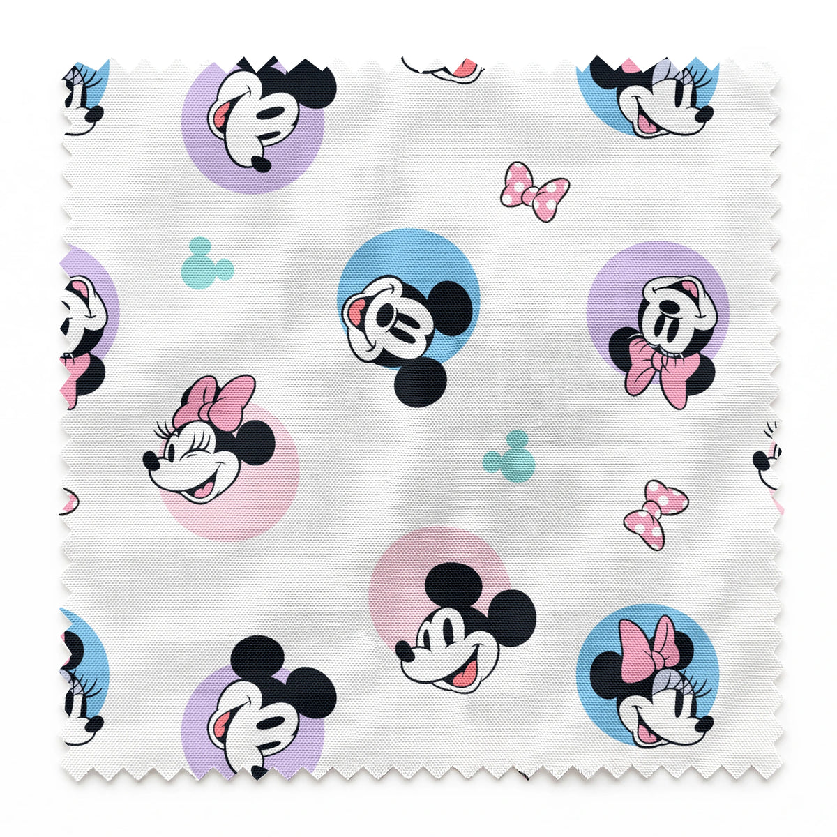 Disney Mickey and Minnie Mouse pattern with character heads on pastel circles, pink bows, and small Mickey icons springs swatch pinked