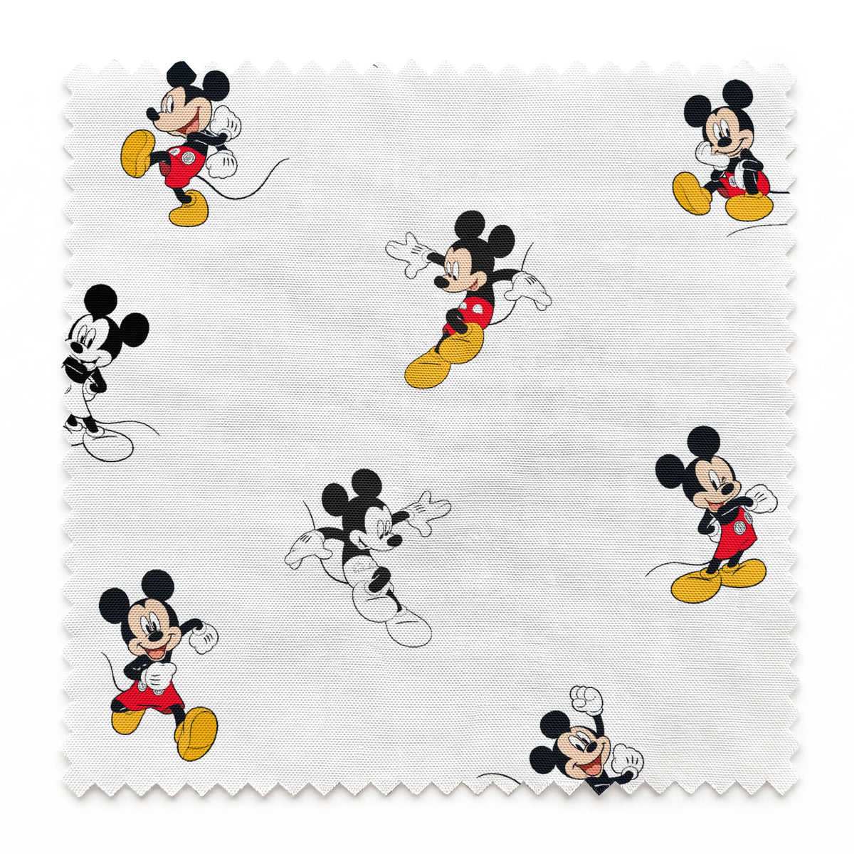 Repeating pattern of Mickey Mouse cartoon characters in various poses on white background springs swatch pinked