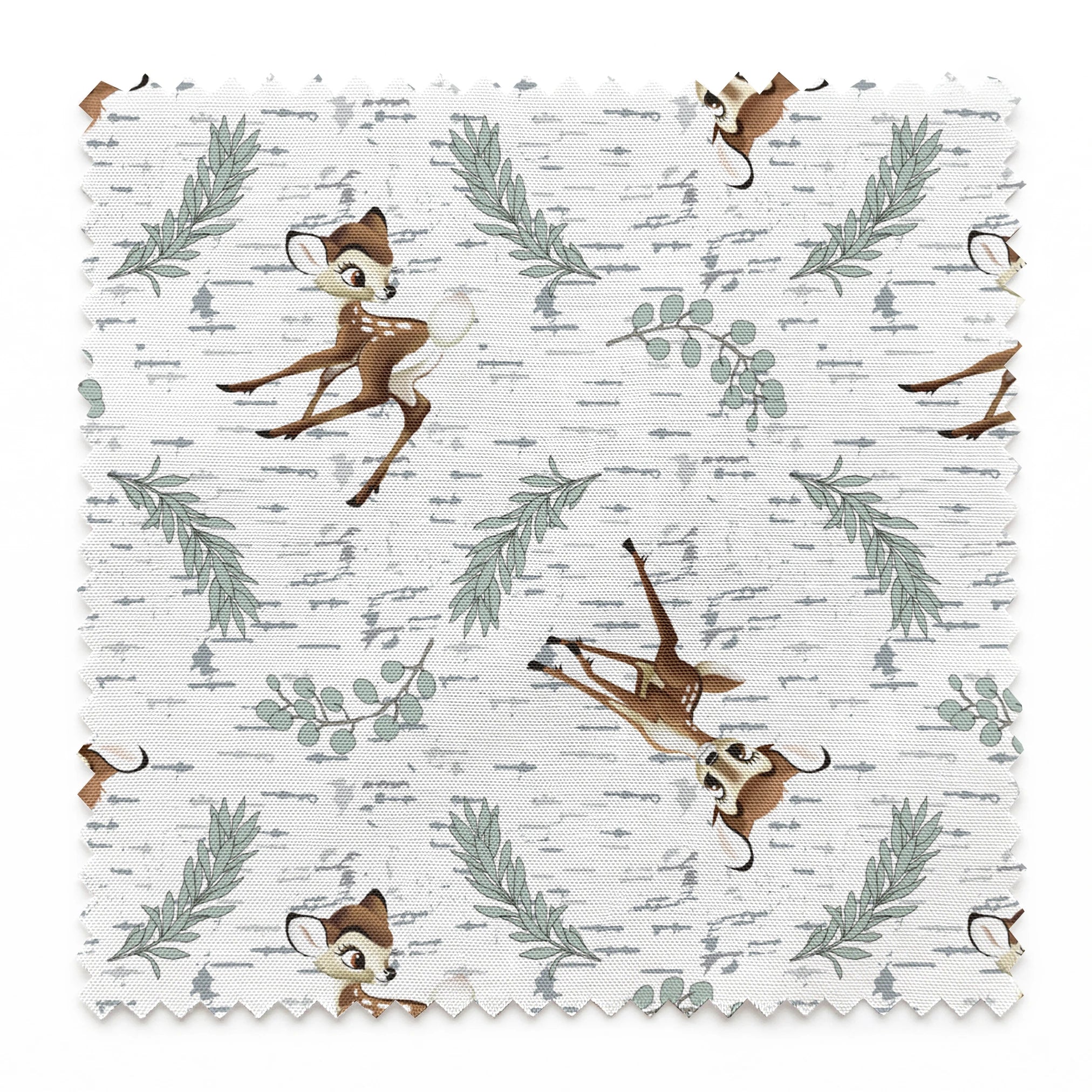Disney’s Bambi surrounded by sage green sprigs, leafy branches, and birch bark textures on a white background in a woodland-themed scattered repeat. springs swatch pinked