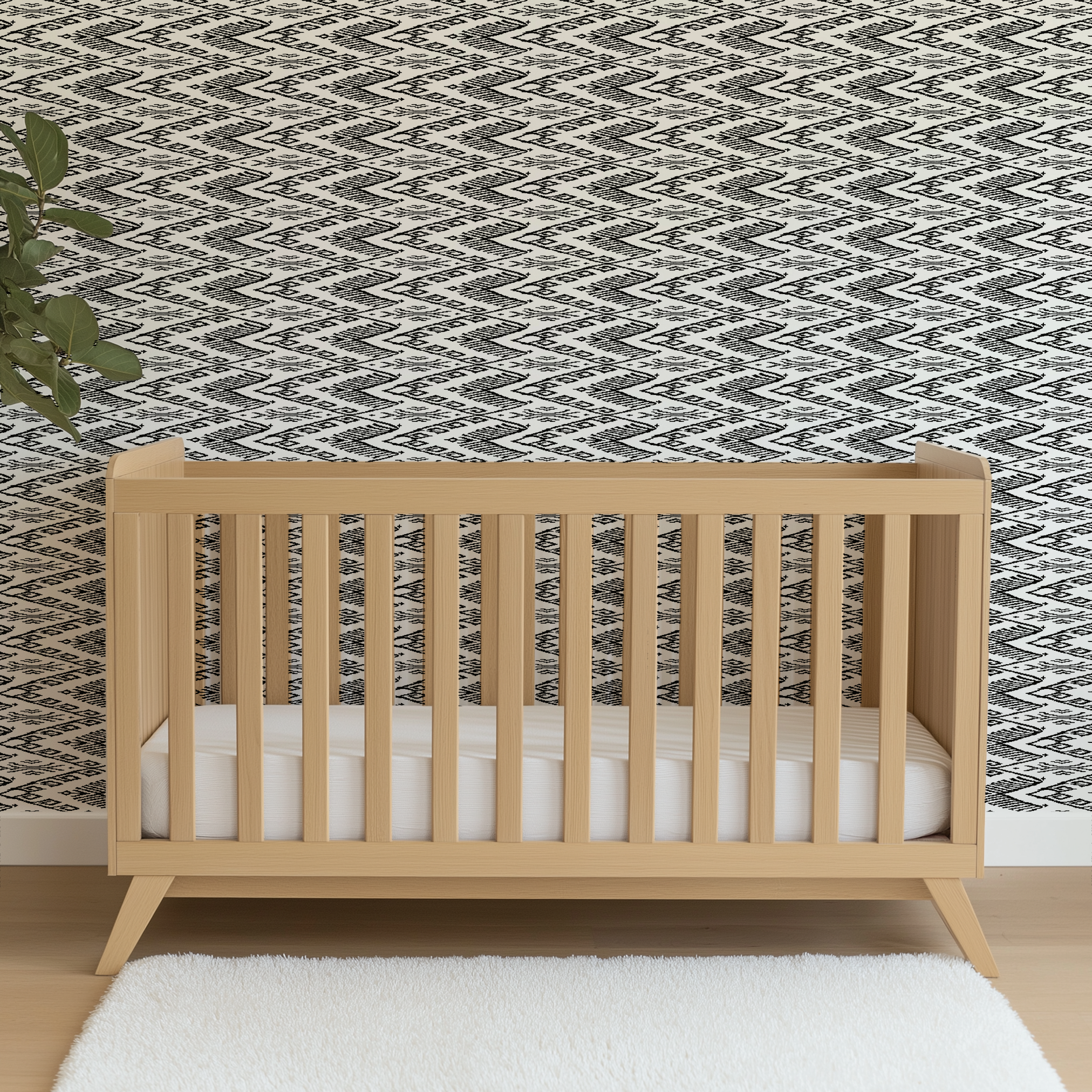 Black and white geometric pattern with diamond shapes and zigzag motifs on a textile surface wallpaper crib mockup