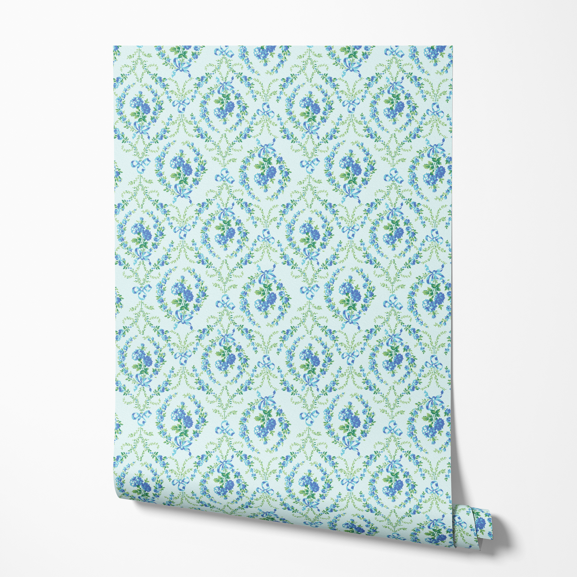 Blue floral pattern with diamond lattice design featuring delicate ribbons and green foliage on light background wallpaper roll mockup