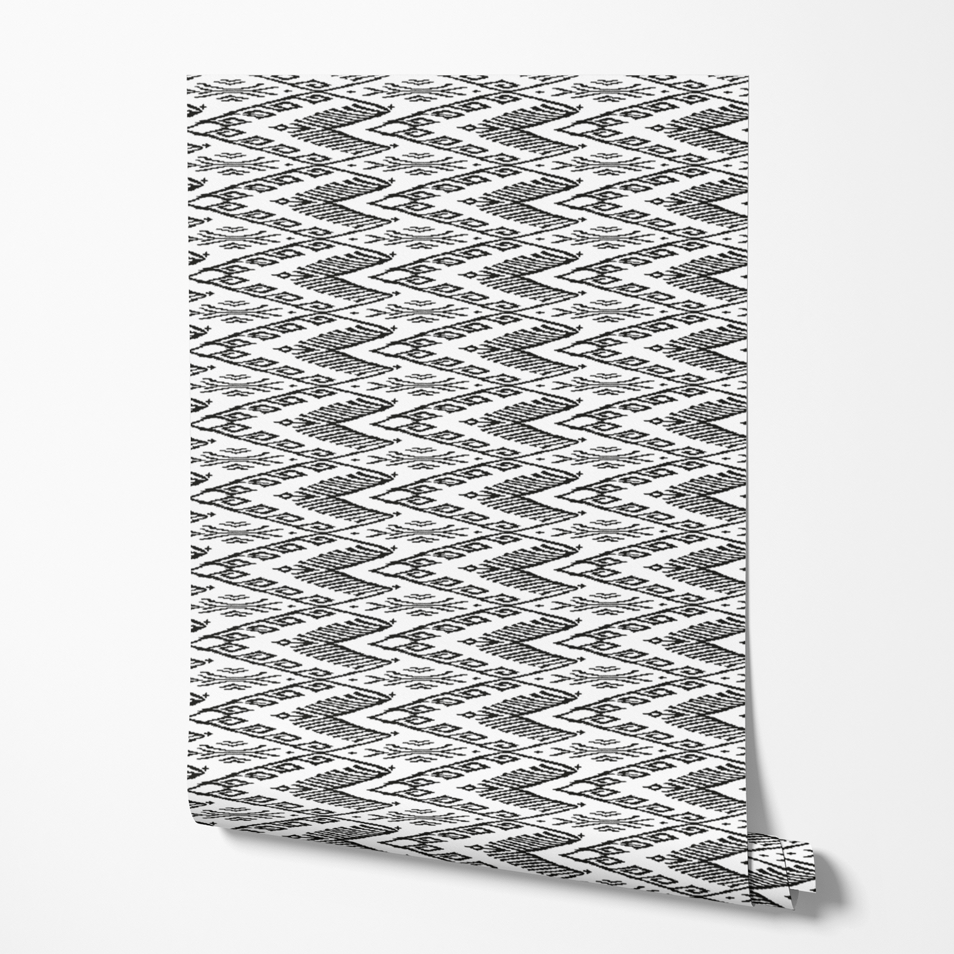 Black and white geometric pattern with diamond shapes and zigzag motifs on a textile surface wallpaper roll mockup